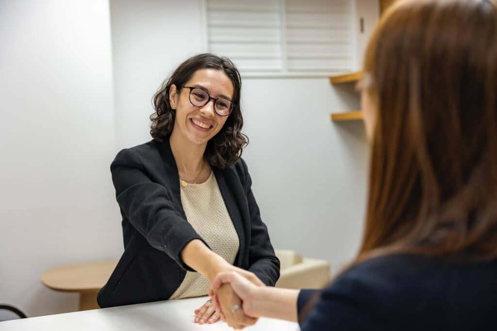 A lady being offered a position at a law firm as newly qualified