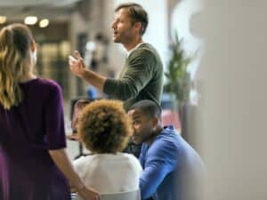 Businessman talking to colleagues in meeting